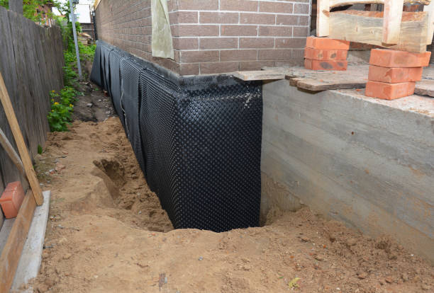 Happy homeowners after waterproofing job in Baldwinsville